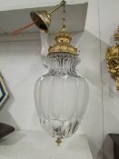 A glass and brass hall light