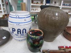 A ceramic barrel and 2 ceramic pots (1 a