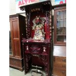 A Chinese lacquered cabinet with large o