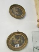 2 small oval pictures