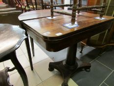 A Victorian fold over games table, top a