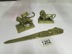 2 brass animals and a letter opener