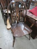 A wheel back elbow chair