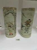 A pair of cylindrical Oriental vases