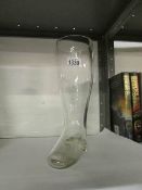A large glass German 'boot' beer glass