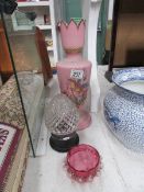 A Victorian pink glass vase decorated wi