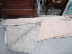 A cream shag pile rug
