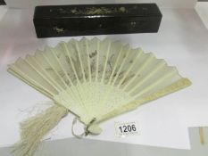 A hand painted fan in original case (a/f