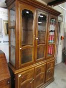 A display cabinet with cupboard base and