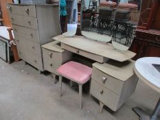 A retro dressing table with stool and ma