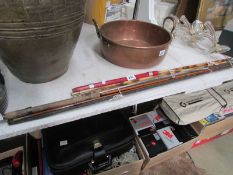 A vintage cane fishing rod and one other