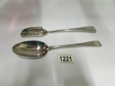A Georgian silver Stilton scoop and a Ge