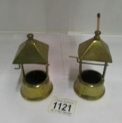 A pair of brass wishing well shaped 'go