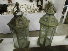 2 metal and glass candle lanterns