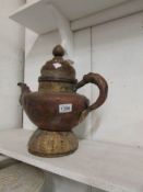 A large urn/lidded teapot in middle east