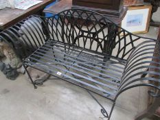 A wrought iron garden seat