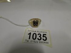 A 9ct gold Masonic ring (6.2gms)