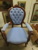 A mahogany framed chair with blue uphols