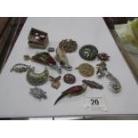 A mixed lot of brooches, earrings etc