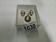 A pair of cameo earrings and silver came