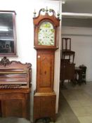 A 19th century 8 day long case clock by William Foster, Lincoln with painted dial and oak and