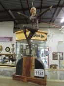 An Art Deco style spelter figure on a ma