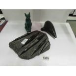A fossil, a cat figure and an ochorina b