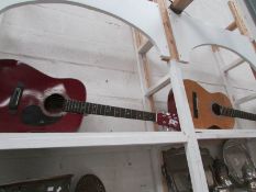A classical guitar and a jumbo guitar a/