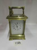 A brass carriage clock marked 'Patent JR