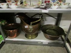A copper coal scuttle, 2 copper pots and