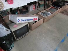 2 boxed Commodore 64 computers together