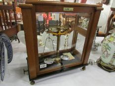 A cased set of Oertling balance scales w