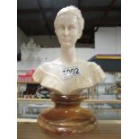 A bust of a lady on alabaster base