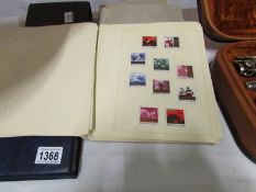 4 albums of world stamps and 2 albums of
