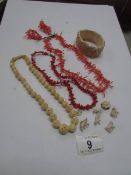 2 coral necklaces, a pair of coral earri