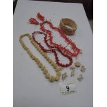 2 coral necklaces, a pair of coral earri