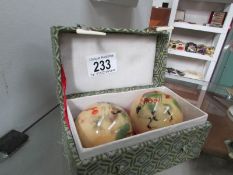 A boxed pair of worry balls