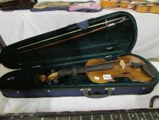 A modern violin and bow with case