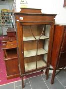 An oak display cabinet