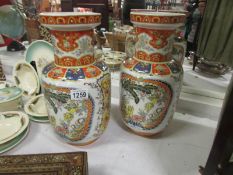 A pair of Oriental 'pekin' vases