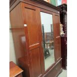 A mahogany inlaid wardrobe