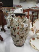 An Oriental vase with floral and bird de