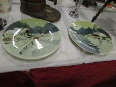 A pair of winter scene wall plates