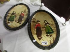 A pair of Bretby wall plaques