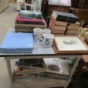 A mixed lot of military themed items including books, plates, prints,