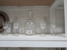4 decanters and a set of 6 etched glasses