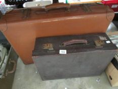 An old suitcase and a vanity case