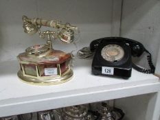 A vintage black dial telephone and a contemporary dial telephone