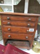 A miniature chest of drawers