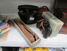A Zeiss Nettar camera, German binoculars in metal case,